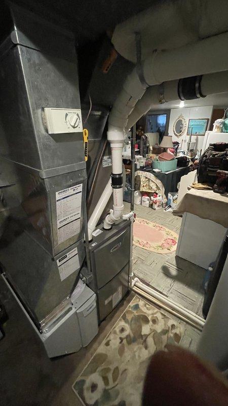 Successfully installed a Lennox ML196UH070 furnace with 1610 media air cleaner and T4 thermostat in residential basement utility area. Completed all necessary connections to existing ductwork and ventilation system, including proper PVC venting. Performed comprehensive system testing and verification, documenting all operational parameters on Lennox technical form including gas manifold pressure, combustion values, and static pressure measurements.