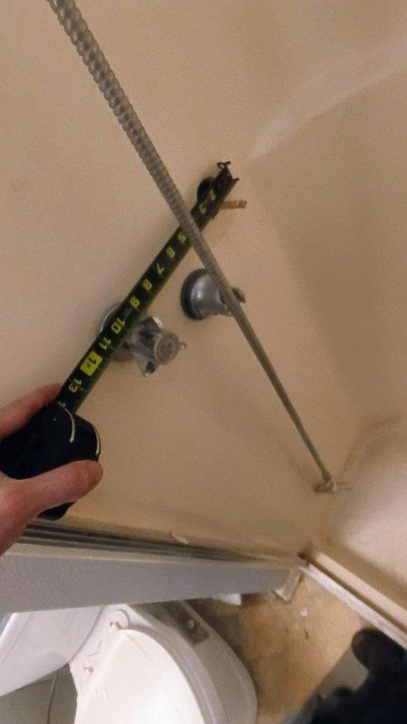 Responded to emergency service call for a customer who broke a fixture while attempting to replace a faucet, resulting in a water leak requiring complete water shut-off. Performed diagnostic inspection, taking measurements of the exposed pipe extension and examining the plumbing configuration in the ceiling joists to identify the proper repair solution. Successfully replaced the damaged fixture components, restored water service, and verified proper functionality with no leaks present.