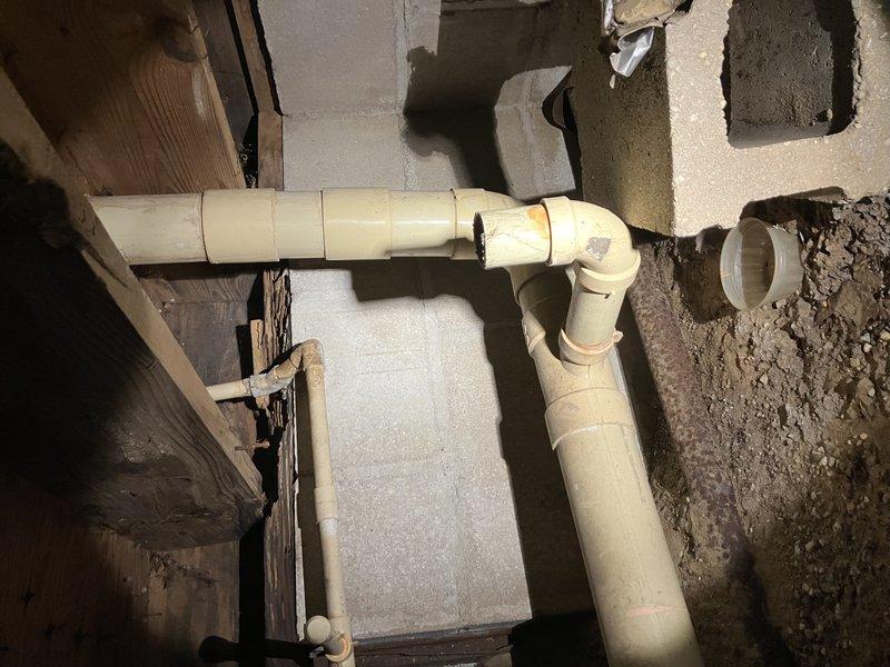 Removed customer's old toilet and installed new American Standard unit. Replaced broken shut-off valve and reconnected drainage system, ensuring proper connection to the existing PVC waste line that runs through the basement/crawl space. Verified installation was secure with no leaks after restoring water supply.