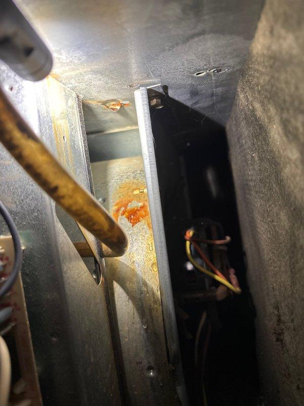 Performed scheduled A/C maintenance service per membership agreement. Inspection revealed significant corrosion and rust on interior metal components, particularly around the condensate drain area, as well as aging wiring connections at the circuit board. System is operational but showing signs of age-related deterioration that should be monitored.