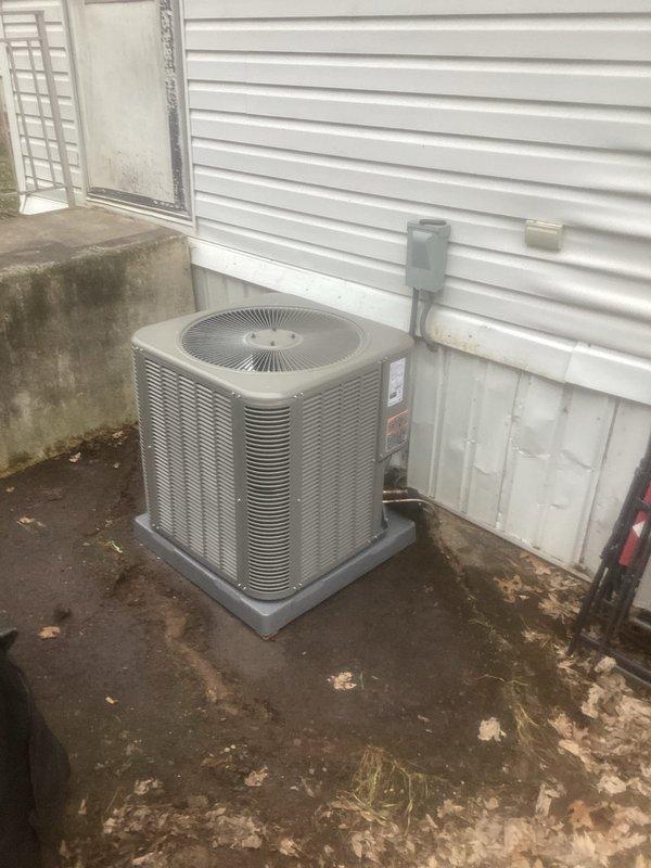 Completed installation of Lennox ML13KC1-030 air conditioning system with Mobile Home Coil. Unit was properly positioned on concrete pad adjacent to residence with electrical disconnect mounted on exterior wall. Existing thermostat was reused as specified in work order, and system was tested for proper operation.