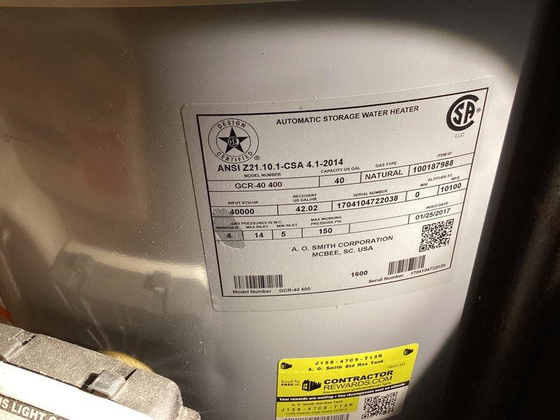 Inspected exterior hose bibb showing significant corrosion and mineral buildup, confirming need for replacement. Evaluated water heater (A.O. Smith GCR-40 400, 40-gallon natural gas unit manufactured 01/2017) and existing shutoff valve configuration. Recommended installation of new frost-free hose bibb with interior shutoff valve to prevent future freeze damage and provide easier maintenance access.