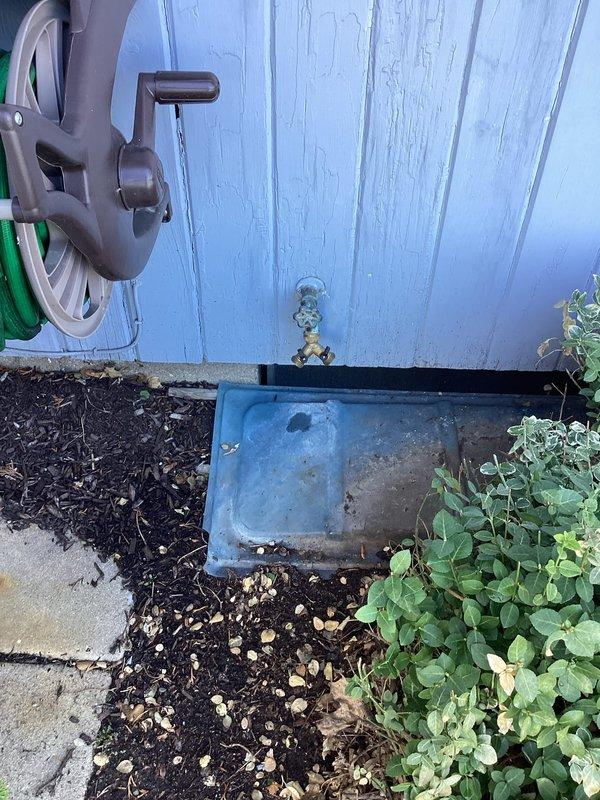 Inspected exterior hose bibb showing significant corrosion and mineral buildup, confirming need for replacement. Evaluated water heater (A.O. Smith GCR-40 400, 40-gallon natural gas unit manufactured 01/2017) and existing shutoff valve configuration. Recommended installation of new frost-free hose bibb with interior shutoff valve to prevent future freeze damage and provide easier maintenance access.