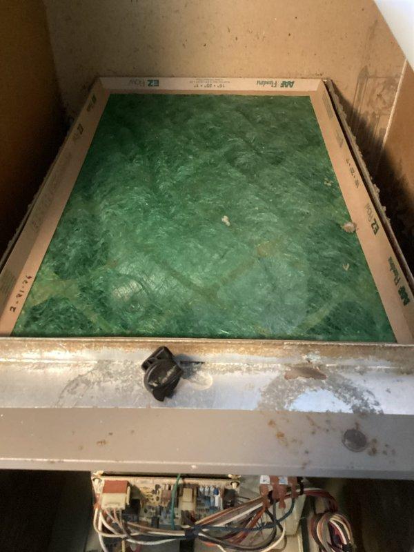 Responded to no heat call for 12-year-old system where unit was cycling off after brief operation. Diagnostic inspection revealed significant dust accumulation in the blower wheel assembly and deteriorated fiberglass filter panel. Cleaned blower wheel to restore proper airflow and replaced filter to prevent system overheating, resolving the intermittent operation issue.