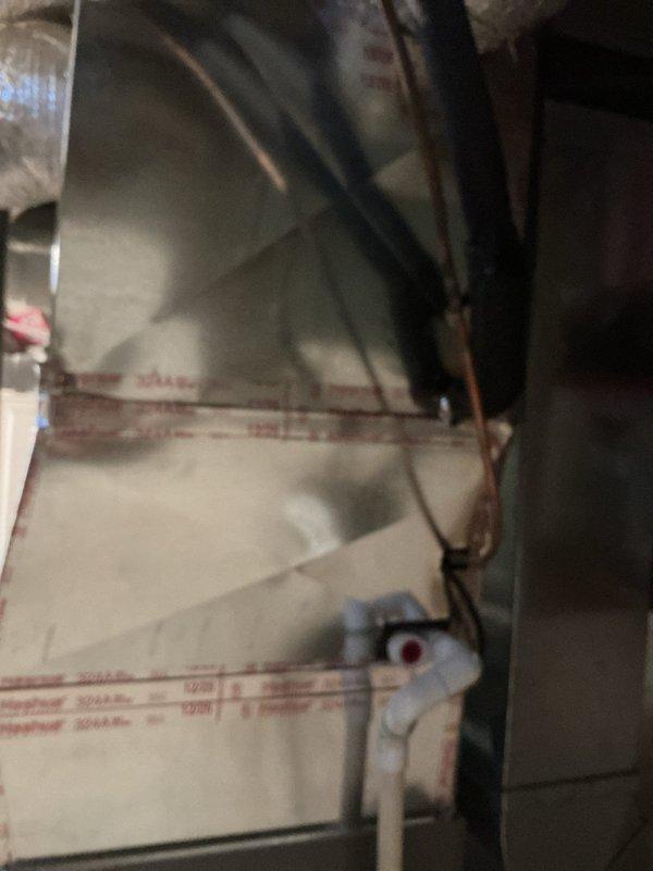 Successfully installed new Lennox EL297UH090XV48C high-efficiency furnace with T6 thermostat in basement utility room. Connected white PVC exhaust venting through ceiling and properly installed condensate drain line to existing floor drain. Reconnected system to existing air filter and verified proper operation of all components.