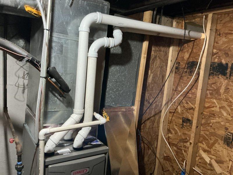 Successfully installed a Lennox ML196UH045 furnace with new PVC venting system in basement utility area. Installation included T4 thermostat and condensate pump with associated tubing. Customer was advised about safety concerns regarding damaged steps (#3 and #4) that landlord has committed to repair.