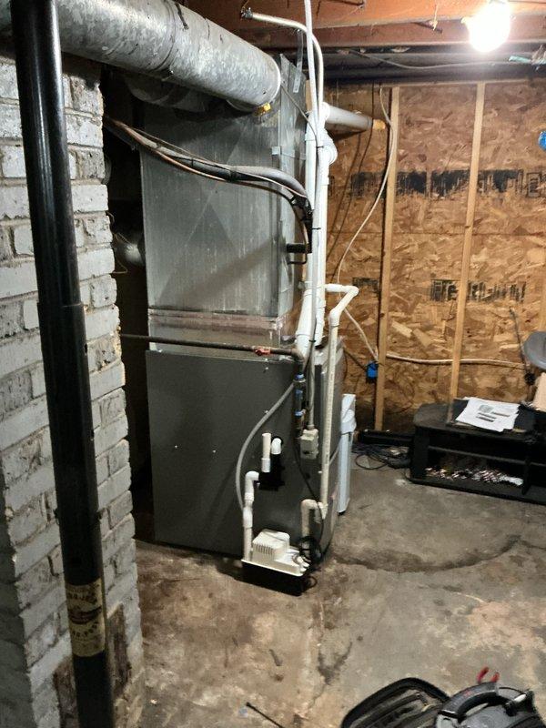 Successfully installed a Lennox ML196UH045 furnace with new PVC venting system in basement utility area. Installation included T4 thermostat and condensate pump with associated tubing. Customer was advised about safety concerns regarding damaged steps (#3 and #4) that landlord has committed to repair.