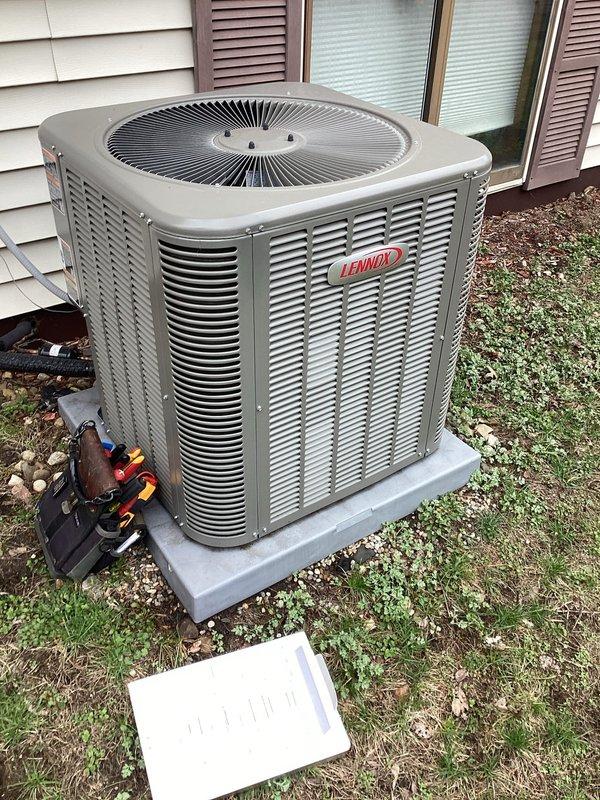Performed scheduled AC maintenance on Lennox outdoor condensing unit. Inspected system components, checked refrigerant lines, and cleaned condenser coils. Unit is properly mounted on concrete pad with adequate clearance; system is operating within normal parameters following service.