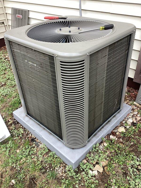 Performed scheduled AC maintenance on Lennox outdoor condensing unit. Inspected system components, checked refrigerant lines, and cleaned condenser coils. Unit is properly mounted on concrete pad with adequate clearance; system is operating within normal parameters following service.