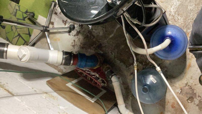 Performed main drain cleanout service in basement utility area with visible PVC piping system. Cleared blockage in the drainage system affecting the kitchen sink. Restored proper water flow and drainage functionality to the plumbing system.