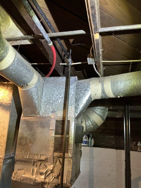 Completed re-piping of gas lines from meter to multiple appliances in basement utility area. Cleaned threads and resealed all fittings at connection points, including manifold assembly with color-coded connectors. Performed comprehensive pressure test upon completion to verify system integrity with zero leaks detected.