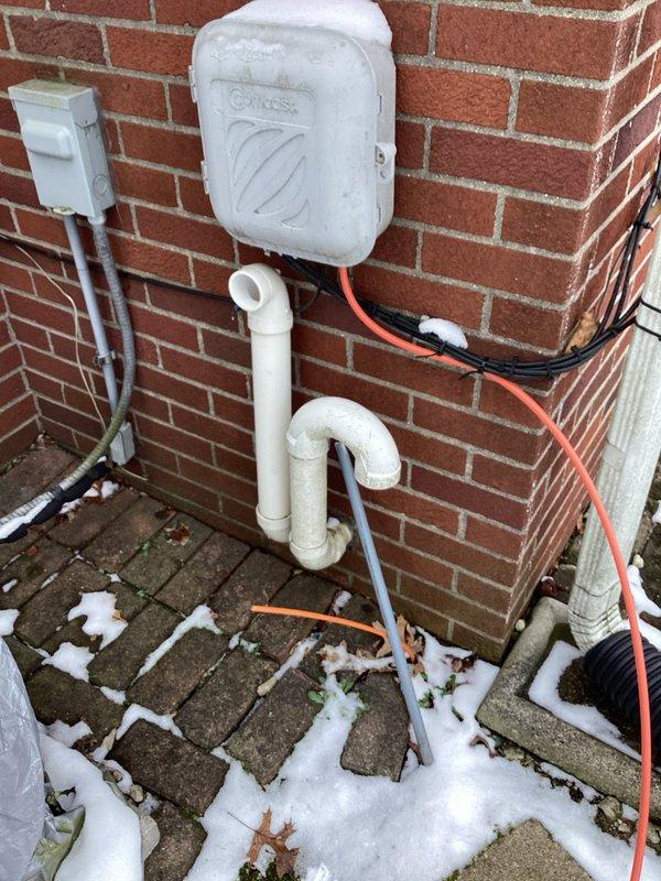 Responded to callback for no heat issue on recent installation. Inspected exterior condensate line configuration and PVC venting on Genesis unit. Found improper installation of AprilAire humidifier components and corrected wiring connections at the furnace. System now operating normally with proper heat output.
