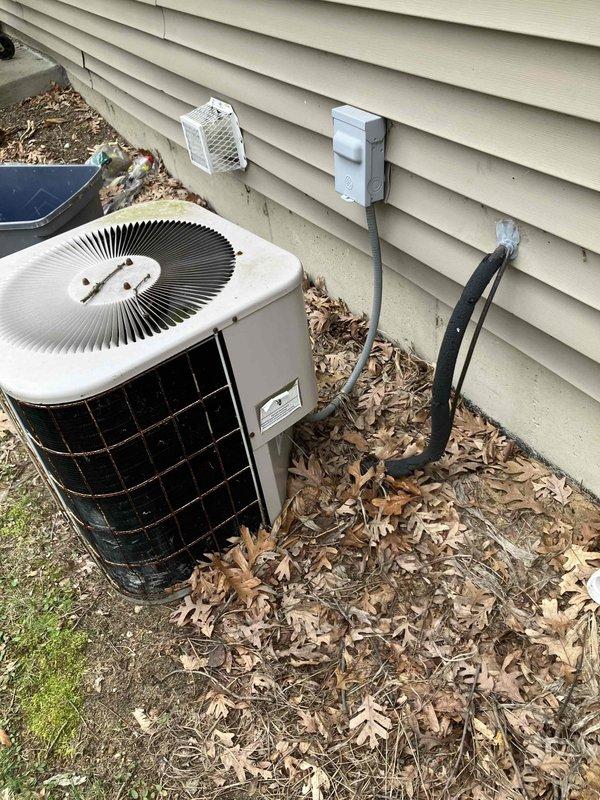 # HVAC System Replacement Estimate

Responded to service call for 23-year-old residential HVAC system with complete furnace failure. Upon arrival, confirmed no airflow through vents, no breaker trips, and furnace not operational. Conducted comprehensive assessment of existing heating and cooling equipment including outdoor condensing unit and interior ductwork system. Evaluated current system condition, noting age-related deterioration and end-of-service-life status of both heating and cooling components. Documented existing installation configuration including exterior AC unit location along building perimeter and interior furnace/ductwork arrangement in basement utility area. Photographed current equipment setup showing outdoor condensing unit with leaf debris accumulation and interior ductwork with exposed metal runs and structural framing. Prepared detailed estimates for two options: air conditioning replacement only and complete HVAC system replacement including both furnace and a