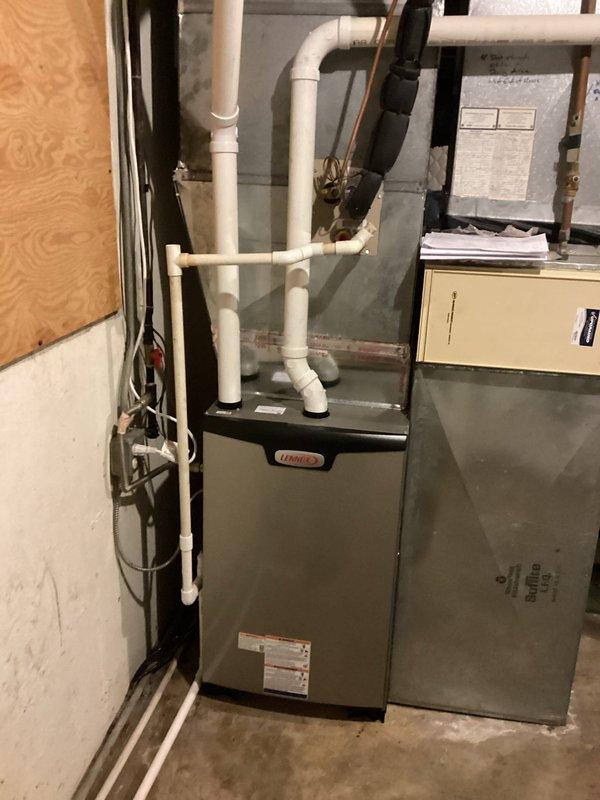 # HVAC Install - Complete System - CH

## Job Summary

Successfully completed installation of a complete HVAC system consisting of a Lennox EL297 high-efficiency furnace with 1610 media filter and a Lennox ML13 air conditioning unit, reusing existing thermostats for both systems.

## Work Performed

Installed Lennox EL297 variable-speed gas furnace in basement utility area with proper venting configuration using PVC piping system. Integrated 1610 media filter cabinet for enhanced air quality and system protection. Configured condensate drainage system with appropriate routing and connections. Mounted and secured furnace unit on concrete pad with proper clearances maintained per manufacturer specifications.

Installed Lennox ML13 split-system air conditioning unit with outdoor condenser and indoor evaporator coil. Ran refrigerant lines between outdoor and indoor components using copper line sets with proper insulation. Connected evaporator coil to furnace plenum for integrated cooling o