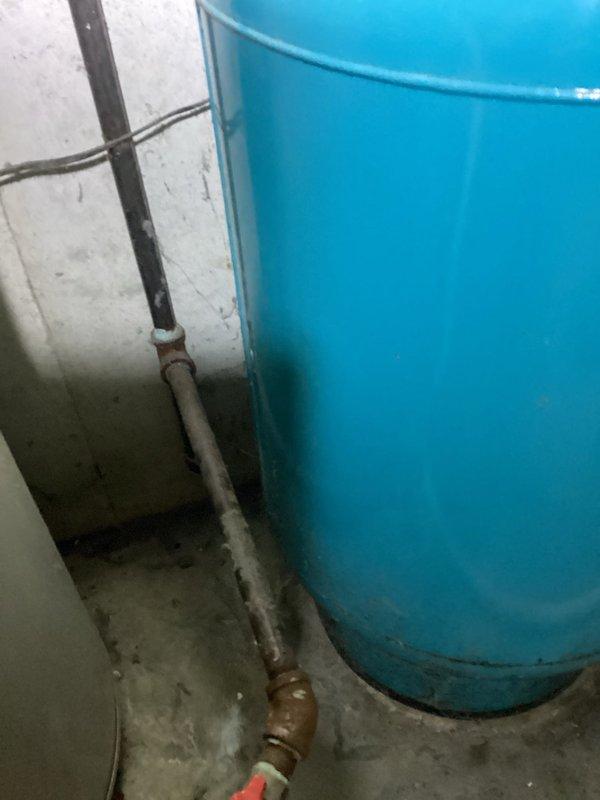 # Water Heater Replacement Estimate

Conducted on-site assessment for conversion from gas-fired to electric water heater system. Evaluated existing 20-year-old gas water heater installation, including current venting configuration, gas supply lines, and electrical service capacity. Documented existing plumbing connections, pressure relief valve positioning, and drain pan requirements. Photographed current equipment condition showing aged copper piping, corrosion on fittings, and existing shut-off valves. Assessed electrical panel capacity and routing requirements for new 240V circuit installation needed for electric unit conversion. Provided comprehensive estimate covering removal of existing gas water heater, capping of gas line, installation of appropriately-sized electric water heater, required electrical work, and code-compliant safety devices.