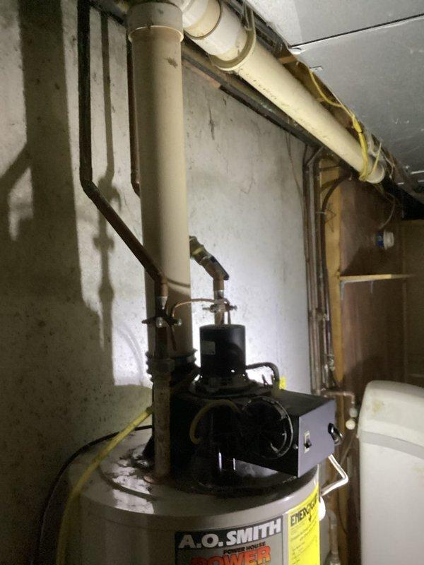 # Water Heater Replacement Estimate

Conducted on-site assessment for conversion from gas-fired to electric water heater system. Evaluated existing 20-year-old gas water heater installation, including current venting configuration, gas supply lines, and electrical service capacity. Documented existing plumbing connections, pressure relief valve positioning, and drain pan requirements. Photographed current equipment condition showing aged copper piping, corrosion on fittings, and existing shut-off valves. Assessed electrical panel capacity and routing requirements for new 240V circuit installation needed for electric unit conversion. Provided comprehensive estimate covering removal of existing gas water heater, capping of gas line, installation of appropriately-sized electric water heater, required electrical work, and code-compliant safety devices.