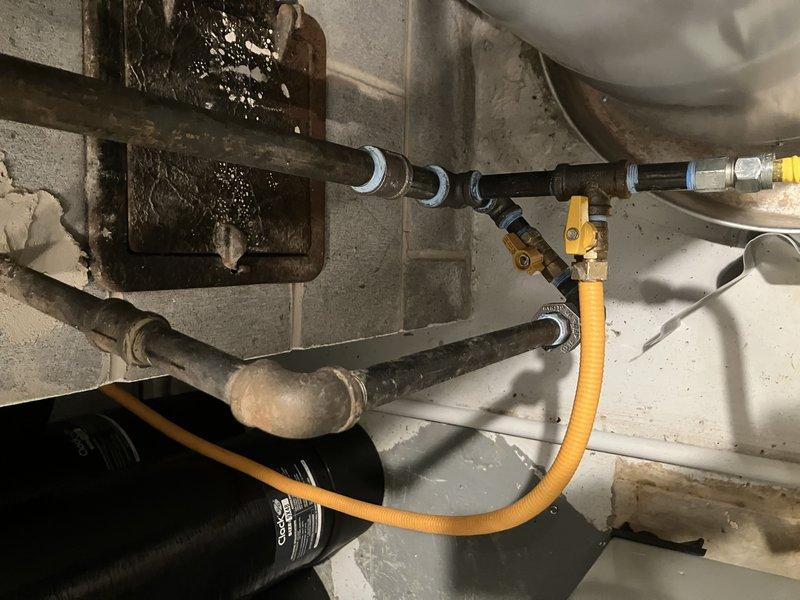 # Service Report: Water Heater Installation

Successfully installed a new 50-gallon draft vent water heater in the utility area, replacing the existing unit per approved specifications. The installation included connecting copper supply lines, gas piping with proper shut-off valves, and appropriate venting system to ensure code-compliant operation. Additionally, performed preventive maintenance on two air conditioning units as part of the scheduled service call, completing all work with full system testing and customer payment collected on-site.