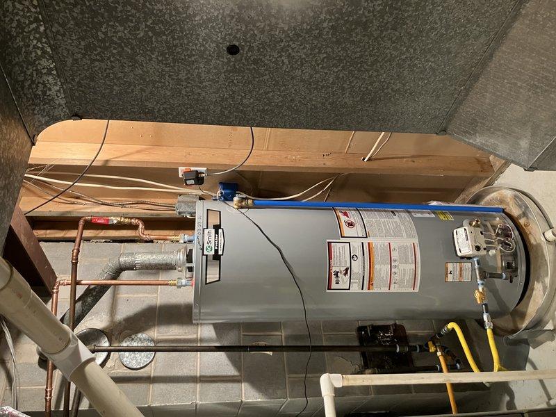 # Service Report: Water Heater Installation

Successfully installed a new 50-gallon draft vent water heater in the utility area, replacing the existing unit per approved specifications. The installation included connecting copper supply lines, gas piping with proper shut-off valves, and appropriate venting system to ensure code-compliant operation. Additionally, performed preventive maintenance on two air conditioning units as part of the scheduled service call, completing all work with full system testing and customer payment collected on-site.