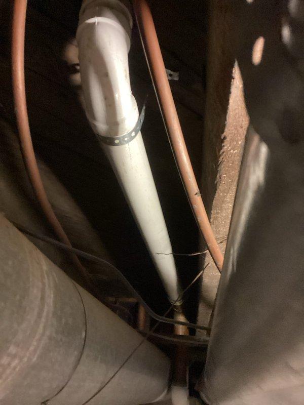 Replaced and reconfigured the drain line assembly for the downstairs bathroom sink. Installed new white PVC P-trap system with proper connections from the sink drain to the main waste line, ensuring correct slope and secure fittings throughout. Verified all connections are leak-free and drainage flows properly.