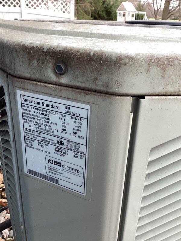 Completed scheduled air conditioning maintenance on American Standard heat pump system (Model 7A6006B1000AB, manufactured April 2011). Performed comprehensive inspection of outdoor unit, noting accumulation of dirt and debris on top casing and between condenser coil fins. Cleaned condenser coils to remove buildup affecting heat transfer efficiency. Replaced 410 filter per membership maintenance agreement. Verified unit specifications and confirmed system operational status. All routine maintenance tasks completed per planned maintenance protocol.