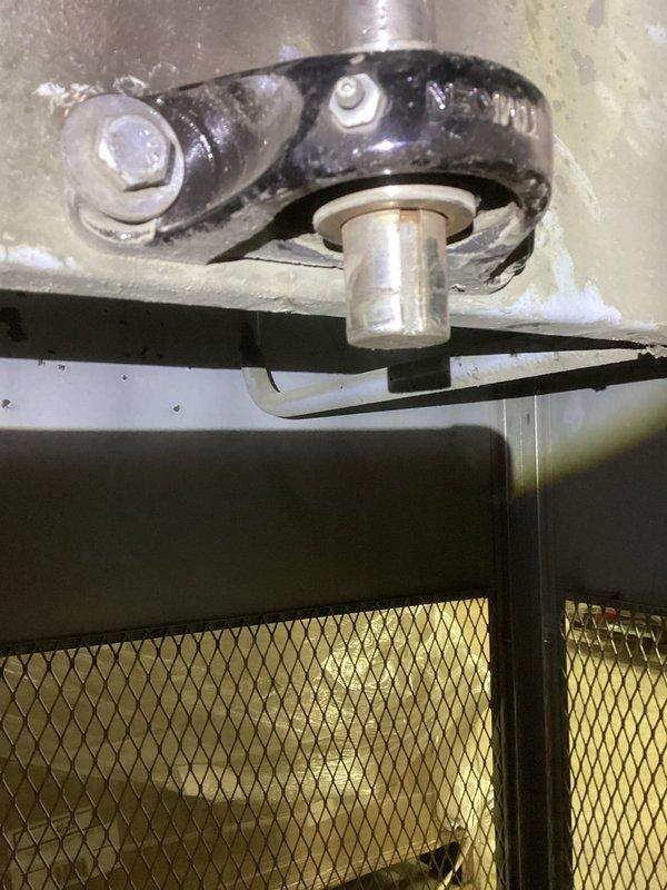 Responded to service call for 22-year-old heating system experiencing loud noise described as similar to a baseball bat hitting metal. Upon inspection, diagnosed worn blower motor bearings on air handler unit, evidenced by excessive noise during operation and visible wear on Timken bearing assembly. Inspected pulley system, motor mounting brackets, and ductwork connections for additional damage or misalignment. Documented condition of equipment with photographs showing bearing assembly, mounting hardware, and surrounding components including filter and ductwork with moisture accumulation and age-related staining. Advised homeowner of findings and recommended replacement of blower motor bearings to restore quiet operation and prevent potential motor failure.