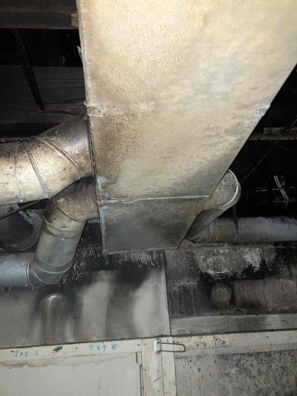 Conducted site assessment of existing HVAC system in crawlspace for restoration project requiring complete system replacement. Evaluated current air handler unit, supply plenum, flexible ductwork connections, and condensate drainage system. Documented deteriorated insulation on plenum box, aging flexible duct runs with compromised connections, and existing drip pan showing signs of corrosion and water damage. Inspected structural conditions including exposed floor joists, subflooring, and identified moisture-related issues on foundation walls that will require remediation prior to new equipment installation. Prepared comprehensive estimate for complete HVAC system replacement including new air handler, properly sized ductwork, updated plenum assembly, and condensate management system to meet current building codes and efficiency standards.