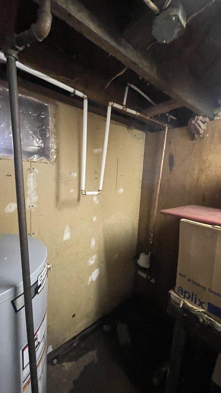 Completed comprehensive re-pipe of residential water distribution system from meter to all fixtures, including two 3-fixture bathrooms, kitchen sink, laundry connection, and two sill faucets. Installed new 40-gallon draft vent water heater with proper venting and provisioned softener loop without bypass valve. All plumbing lines installed to code using PEX and copper piping with appropriate shut-off valves and connections at each fixture location.