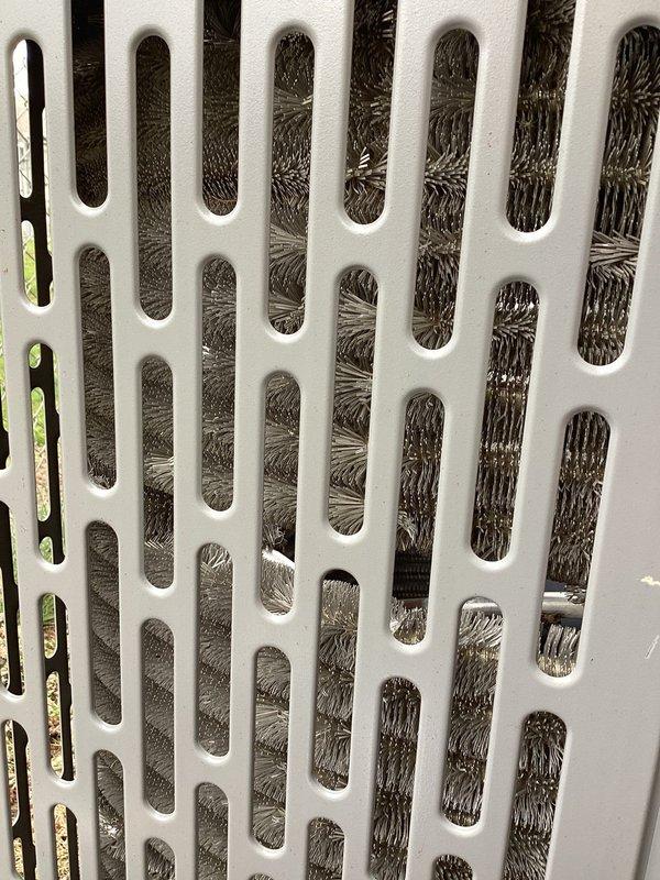 Completed planned air conditioning maintenance as part of HVAC membership agreement. Performed comprehensive system inspection of outdoor condenser unit, including examination of protective grille panels and heat exchanger coils. Documented current condition of unit showing accumulated debris and dirt buildup visible through ventilation slots, which could impact airflow efficiency. Verified 16x25x1 filter specification and completed standard maintenance protocol to ensure optimal system performance for cooling season.