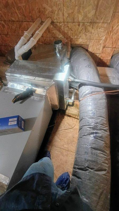 Responded to no cooling complaint on 9-year-old residential air conditioning system. Performed comprehensive leak detection inspection on outdoor condenser units and indoor air handler components. Located refrigerant leak in system, documented equipment condition with photographic evidence of dual outdoor units and attic-mounted air handler with associated ductwork. Provided customer with repair options including leak repair and system recharge based on refrigerant type and equipment age, along with cost estimate for necessary repairs to restore cooling functionality.