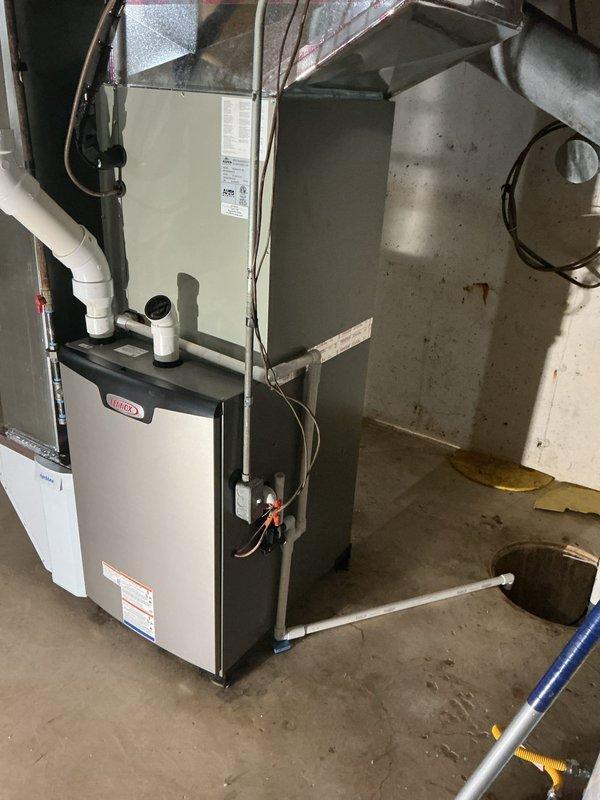 Completed full furnace installation in basement utility area, including new ductwork and plenum system with galvanized sheet metal construction. Installed all associated PVC condensate drainage lines, performed system startup procedures, verified proper operation, and programmed new digital thermostat for optimal climate control.