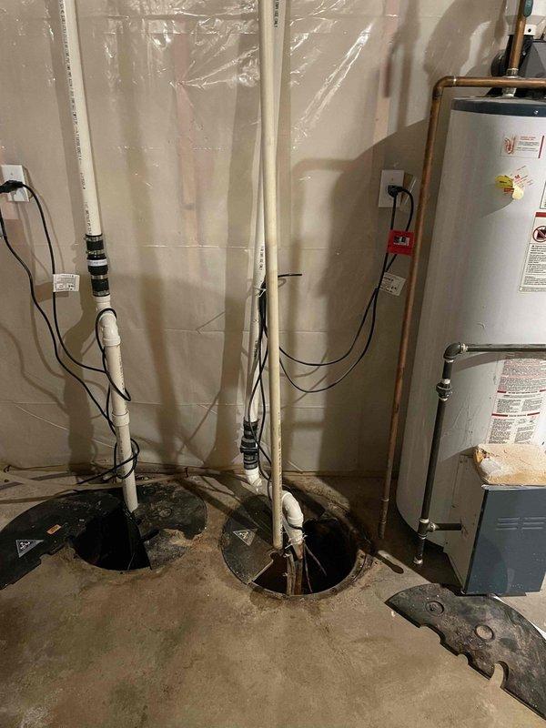 Responded to service call for dual sump pump system with one unit experiencing elevated water levels in basin. Upon inspection, diagnosed malfunctioning float switch on secondary sump pump preventing automatic activation. Primary pump operating normally with proper cycling and discharge. Tested secondary pump motor which functioned when manually activated, confirming float switch as sole failure point. Replaced defective float switch assembly, verified proper float travel and activation points, and tested complete pump cycle under load. Confirmed both pumps now operating correctly with appropriate water level maintenance in respective basins. System restored to full operational capacity with no flooding risk present.