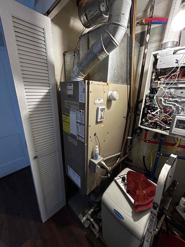 Conducted on-site estimate for tankless water heater replacement with customer requesting 1200 BTU capacity unit. Assessed existing HVAC system including furnace, ductwork, control panel, and humidifier components located in utility closet, as current system is non-operational. Discussed potential bundled installation of new HVAC system along with tankless water heater replacement, reviewed financing options, and documented equipment specifications for proposal preparation.