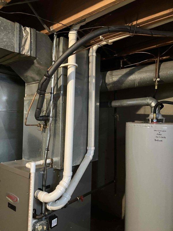 Responded to service call for 16-year-old heating system blowing room temperature air with thermostat set to 76°F but maintaining only 70°F. Performed diagnostic evaluation of furnace and HVAC system located in basement mechanical room. Assessed existing equipment condition, ductwork configuration including flexible metallic ducts and rigid metal distribution system in attic space, and overall system performance. Provided comprehensive estimate for complete HVAC system replacement due to age and inefficiency of current equipment.