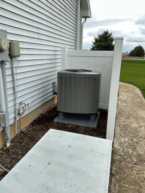 Completed full HVAC system installation including Lennox EL297 high-efficiency furnace, EL16 heat pump, 1610 media filter, and TH6320WF thermostat. Installed heat pump condenser unit on exterior concrete pad with proper clearances from building structure and privacy fence. Ran refrigerant linesets with black foam insulation from outdoor unit to indoor equipment, secured lines with appropriate strapping and routed to electrical disconnect box mounted on exterior wall. Installed PVC condensate drain line vertically along exterior wall for proper drainage. Set condenser unit on mulched landscaped area with adequate service access. Verified all electrical connections at disconnect box and metering equipment. Ran new thermostat wiring as needed to accommodate TH6320WF WiFi-enabled thermostat installation. Completed all refrigerant line connections, evacuated system, and charged to manufacturer specifications. Tested heat pump operation in both heating and cooling modes, verified proper airf