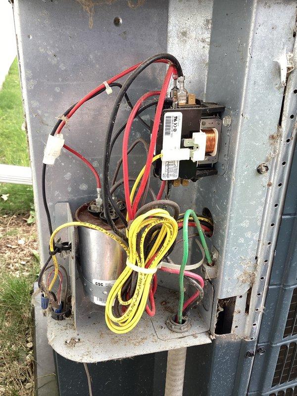 Completed planned air conditioning maintenance on Guardian outdoor condensing unit per membership agreement. Performed comprehensive system inspection including electrical compartment evaluation, verifying contactor operation, capacitor condition, and all electrical connections. Inspected wiring harnesses for proper terminations and signs of wear. Evaluated outdoor unit exterior condition, noting some weathering and minor surface rust on electrical compartment housing consistent with outdoor installation age. Verified unit is properly mounted on concrete pad with adequate clearance for airflow. All electrical components functioning within normal parameters at time of service.