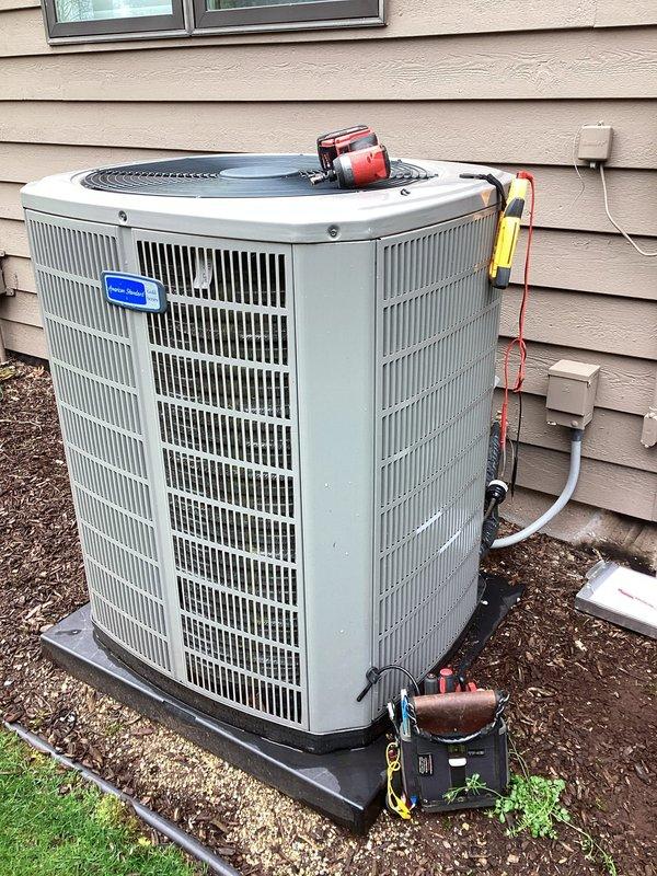 Completed comprehensive air conditioning tune-up on outdoor condensing unit, including inspection of electrical components, capacitor testing, and system diagnostics per maintenance protocol CWOW210 and checklist #10. All electrical connections were verified secure, capacitor tested within specifications, and unit confirmed operating properly with no issues identified during the planned maintenance service.