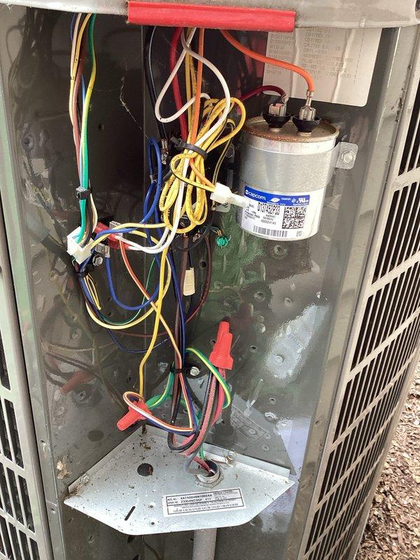 Completed comprehensive air conditioning tune-up on outdoor condensing unit, including inspection of electrical components, capacitor testing, and system diagnostics per maintenance protocol CWOW210 and checklist #10. All electrical connections were verified secure, capacitor tested within specifications, and unit confirmed operating properly with no issues identified during the planned maintenance service.