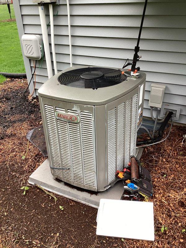 Completed planned air conditioning maintenance on Lennox outdoor condensing unit. Inspected evaporator coil and found significant dust and debris accumulation on aluminum fins; noted dirty condenser coil requiring attention. Performed standard maintenance protocol including pressure testing with manifold gauges, verified refrigerant charge levels, inspected electrical connections at disconnect box, and checked lineset insulation condition. System operational upon completion of maintenance visit.
