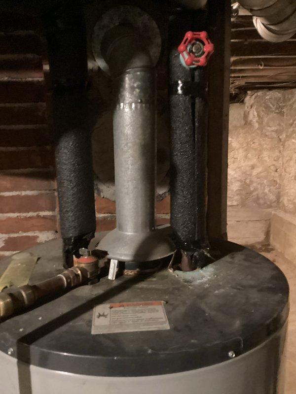 Completed estimate for water heater replacement on existing 40-gallon American Water Heater Company natural gas unit, model G6240S403NO, manufactured in 2008 with 15 years of service life. Current installation features standard residential configuration with three-pipe top connection system, foam-insulated hot and cold water lines, pressure relief valve, and proper combustion clearances in basement utility area. Documented existing unit specifications and installation conditions to provide accurate replacement recommendations for aging water heater approaching end of expected service life.