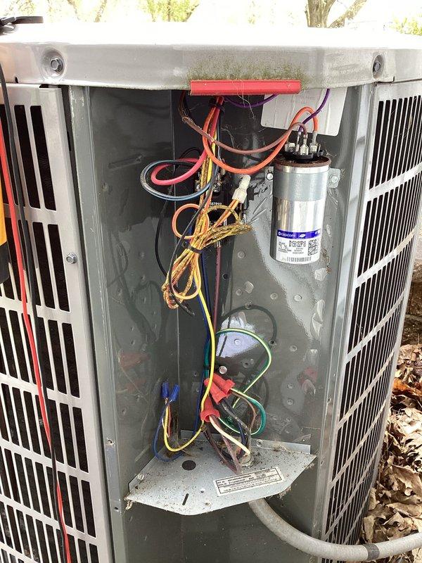 Completed scheduled air conditioning maintenance visit per HVAC membership agreement. Performed comprehensive system inspection of outdoor condensing unit, including removal of access panel to evaluate internal electrical components, capacitor condition, and wiring connections. All electrical connections found secure with no signs of damage or deterioration. Capacitor tested and operating within normal parameters. Verified proper wire routing and condition of all internal components. Inspected exterior cabinet condition, fan grille, and louvers for damage or excessive wear. Cleaned debris accumulation from around unit base and concrete pad area. Confirmed proper clearances maintained around equipment for adequate airflow. Electrical disconnect box and conduit connections inspected and found secure. System operational and functioning as designed upon completion of maintenance service.