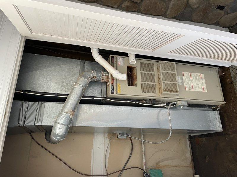 Responded to rental property for reported water leak with unknown location. Upon arrival, accessed property using lockbox and met with customer on-site. Water supply had already been shut off prior to arrival. Conducted thorough inspection of plumbing system and surrounding areas to locate source of reported running water sound. Inspected HVAC system installation in covered exterior area, examining air handler unit, ductwork connections, and surrounding infrastructure for signs of water intrusion or condensate line issues. Investigated ceiling cavity and crawl space areas where flexible metallic ducting and structural components were visible, checking for evidence of active leaks, water staining, or moisture accumulation. No standing water was present at time of inspection. Documented findings with photographic evidence of HVAC equipment, ductwork routing, and ceiling access points for future reference and customer records.