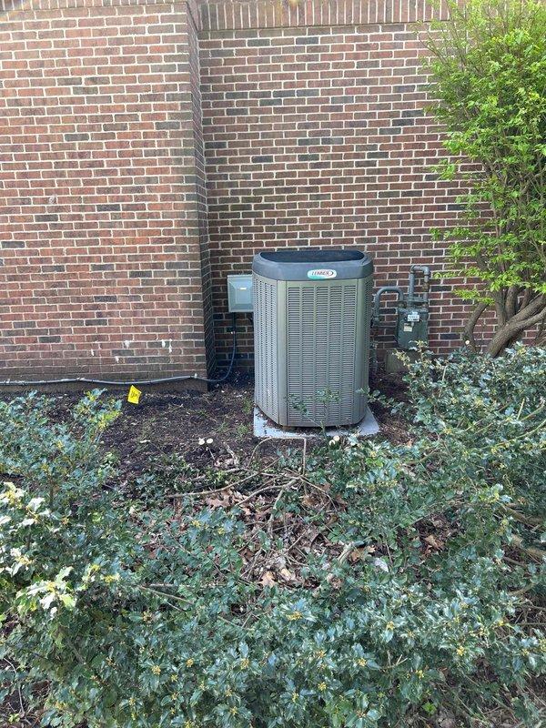Conducted comprehensive HVAC estimate for residential air conditioning system replacement. Evaluated existing Lennox outdoor condensing unit positioned on concrete pad against exterior brick wall, documenting current installation configuration including refrigerant line routing and electrical connections. Assessed system accessibility, clearance requirements, and existing infrastructure to provide replacement recommendations. Photographed current equipment placement and surrounding conditions to support estimate preparation. Reviewed homeowner's preference for air conditioning system upgrade while current unit remains operational.
