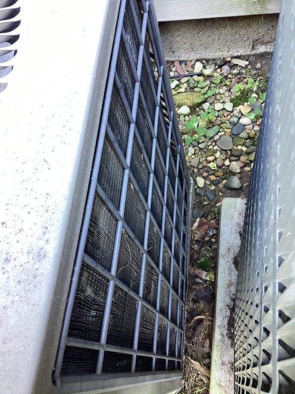 Completed planned air conditioning maintenance on two outdoor condensing units. Performed comprehensive system inspection including visual assessment of both units, with one located in a confined side yard area and another positioned on a concrete pad. The unit on the concrete pad exhibited heavy accumulation of dirt, dust, and debris caked throughout the condenser coils and fins, significantly restricting airflow. Cleaned condenser coils to restore proper heat transfer efficiency and airflow capacity. Replaced 16x20x1 air filter as part of routine maintenance protocol. Inspected electrical connections, refrigerant lines, and mechanical components on both units for proper operation and signs of wear. Documented equipment condition through photographic records showing before-condition of heavily soiled coils and overall unit placement. All systems operational upon completion of maintenance service.