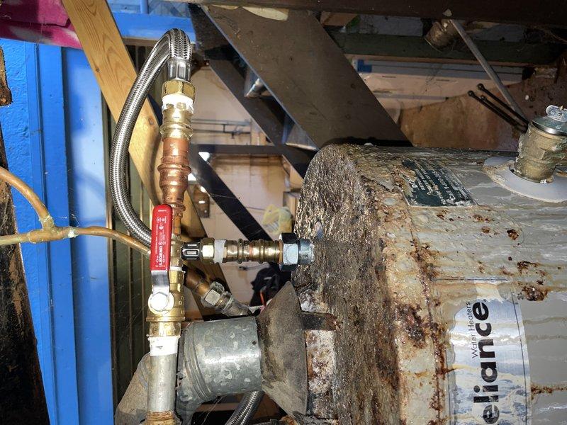 Performed maintenance service on a 6-7 year old tanked water heater upon customer request. Successfully completed water heater flush to remove sediment buildup and addressed a minor leak identified at the tank connections. Unit was operational at time of service, and all plumbing connections were inspected and secured using appropriate brass fittings and valves to ensure proper system integrity.