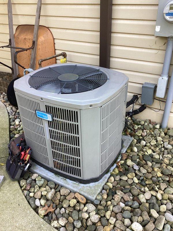 Completed scheduled air conditioning maintenance on residential outdoor condenser unit. Performed comprehensive system inspection including visual examination of electrical components, capacitor, contactor, and wiring connections. All components found to be operating within normal parameters with typical wear consistent with regular use. Unit exterior and internal compartment showed standard accumulation of dust and debris, which is expected for outdoor equipment. Documented system condition through photographic records showing capacitor specifications, electrical connections, and overall unit placement on concrete pad with proper clearances maintained. System operational and ready for continued service.