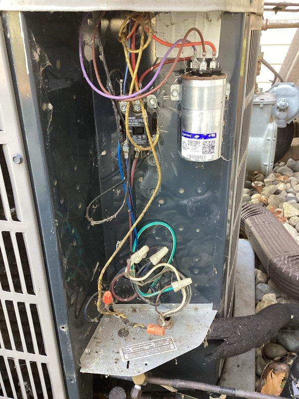 Completed scheduled air conditioning maintenance on residential outdoor condenser unit. Performed comprehensive system inspection including visual examination of electrical components, capacitor, contactor, and wiring connections. All components found to be operating within normal parameters with typical wear consistent with regular use. Unit exterior and internal compartment showed standard accumulation of dust and debris, which is expected for outdoor equipment. Documented system condition through photographic records showing capacitor specifications, electrical connections, and overall unit placement on concrete pad with proper clearances maintained. System operational and ready for continued service.