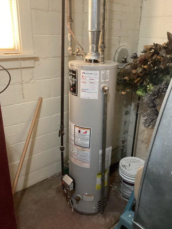 Conducted on-site evaluation of existing water heater installation in residential basement utility area. Assessed current 30-gallon conventional tank water heater with standard venting configuration and documented equipment specifications, piping connections, and available space for potential replacement options. Provided customer with detailed estimates for both traditional tank-style water heaters (30 gallons or less) and tankless water heater alternatives, including discussion of installation requirements, utility connections, and venting modifications needed for each option.