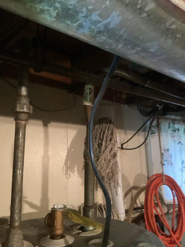 Conducted on-site assessment and provided replacement estimate for 16-year-old 50-gallon residential water heater in owner-occupied single-family home. Unit showed age-related wear consistent with expected service life, with visual documentation captured of existing installation including connecting pipes, venting, and surrounding utility space configuration. Customer coordinated scheduling preferences for future service notification to ensure household availability during installation timeframe.