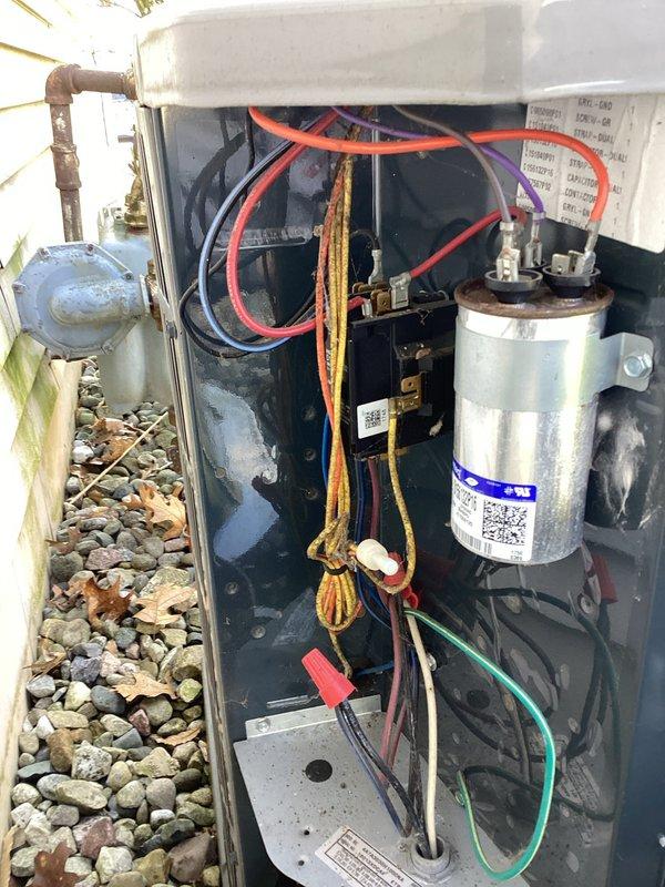 Completed scheduled air conditioning maintenance on American Standard residential condenser unit, model 4A7A3030H1000NA. Performed comprehensive system inspection including visual examination of all electrical components, wiring connections, and capacitor condition. Verified proper compressor operation and assessed overall unit functionality. Documented equipment condition through photographic records showing interior components, electrical connections, and manufacturer specifications. Unit operational and ready for cooling season.