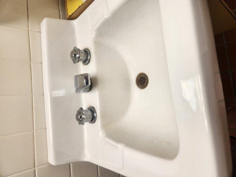 Responded to callback for worsening faucet leaks following previous service visit. Both hot and cold water handles were experiencing continuous water flow from spouts. Removed and replaced worn valve cartridges on bathroom sink faucet assembly. Tested both hot and cold water lines for proper shut-off and confirmed leaks were eliminated.